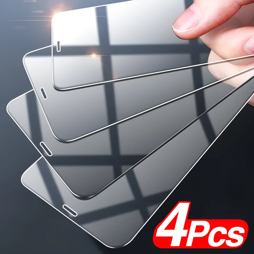 Four transparent tempered glass screen protectors for Apple iPhone on a clean surface.