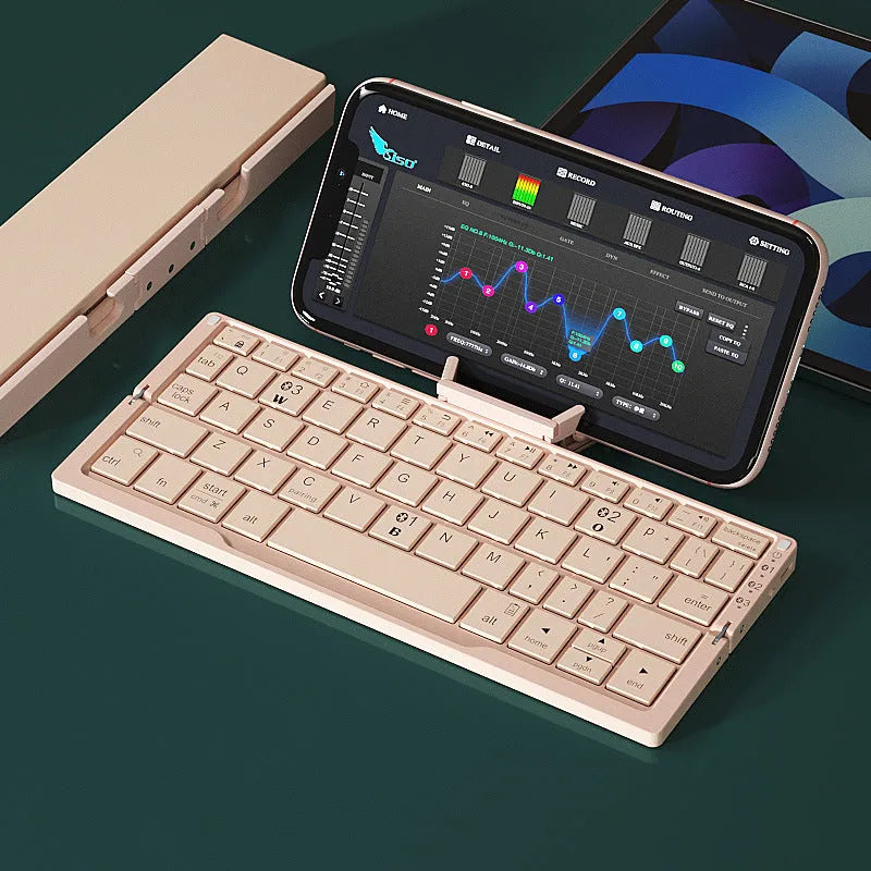 Silver white folding Bluetooth keyboard with hidden stand supporting smartphone, shown open and closed