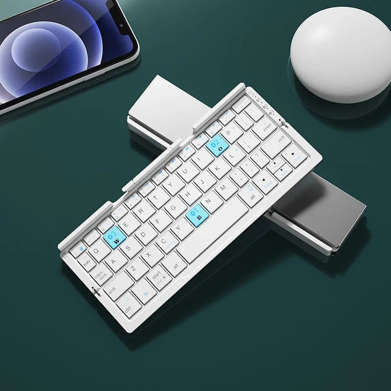 Silver white folding Bluetooth keyboard with hidden stand supporting smartphone, shown open and closed