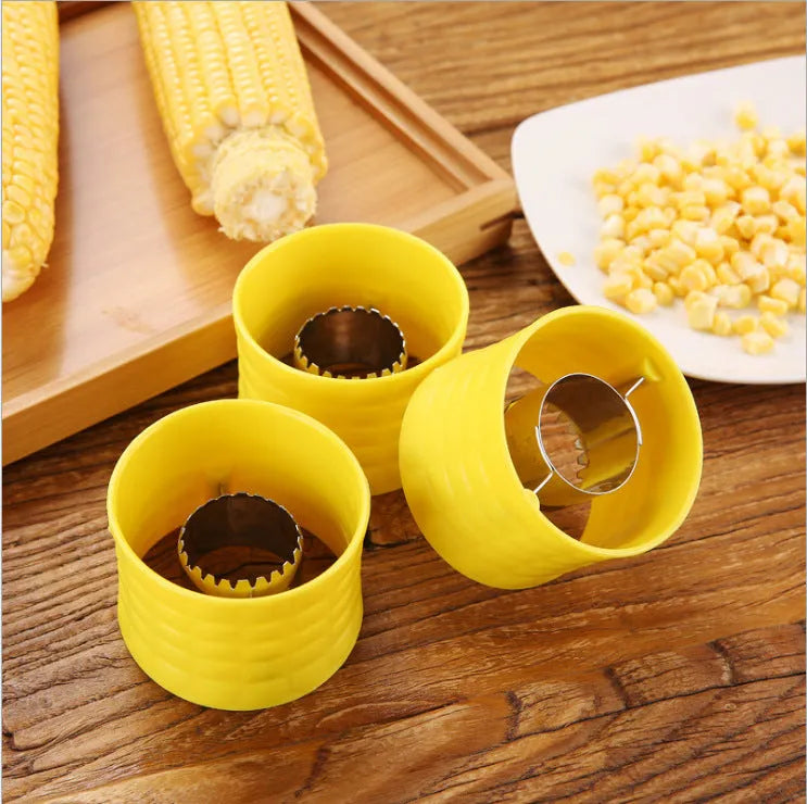 Yellow manual corn thresher kitchen tool with corn-shaped design and stainless steel gear