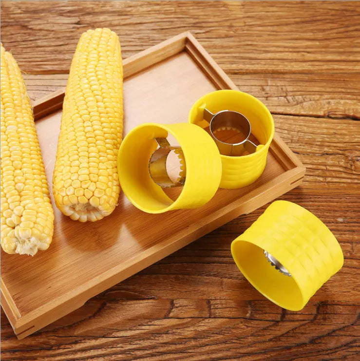 Yellow manual corn thresher kitchen tool with corn-shaped design and stainless steel gear