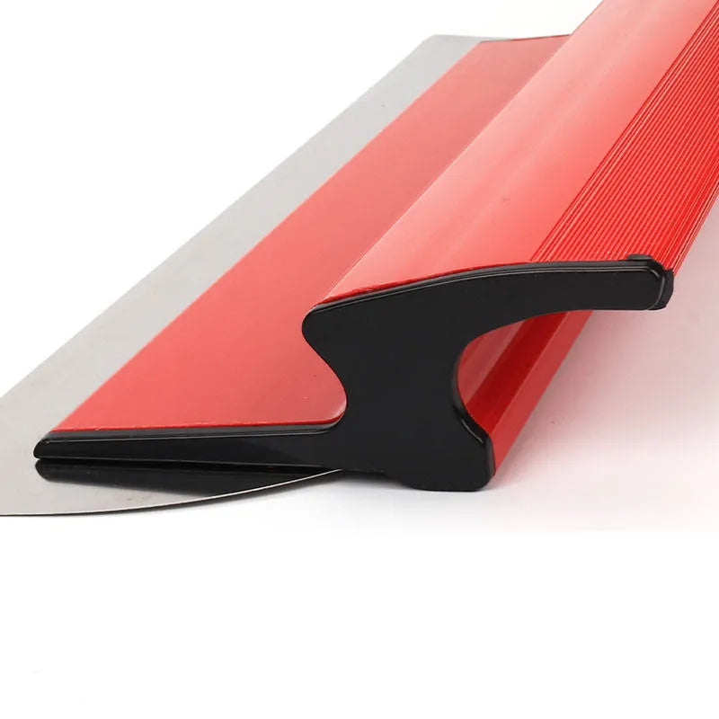 Red leveling scraper tool with a 40 cm wide steel blade for wall preparation
