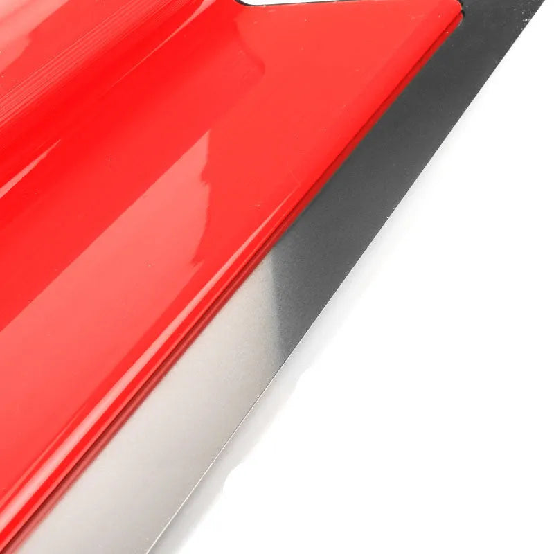 Red leveling scraper tool with a 40 cm wide steel blade for wall preparation