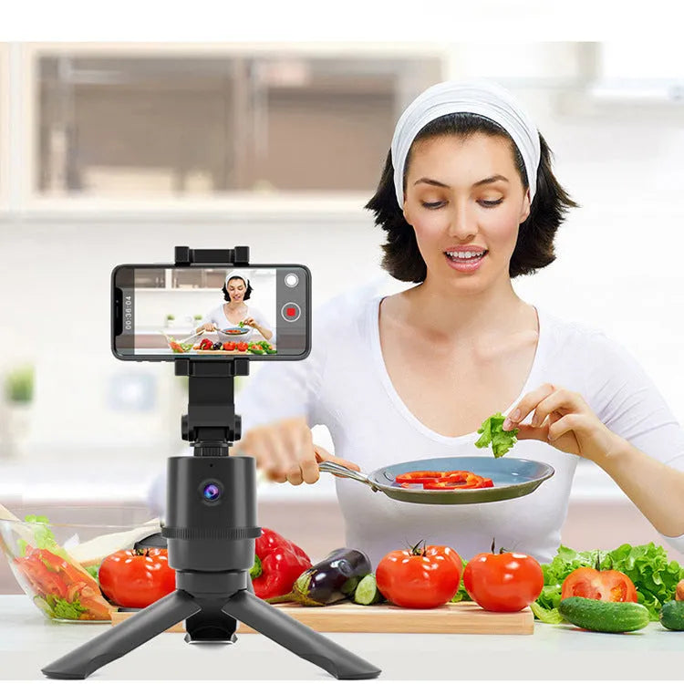 360-degree intelligent tracking pan tilt mobile phone bracket with AI face recognition on a table
