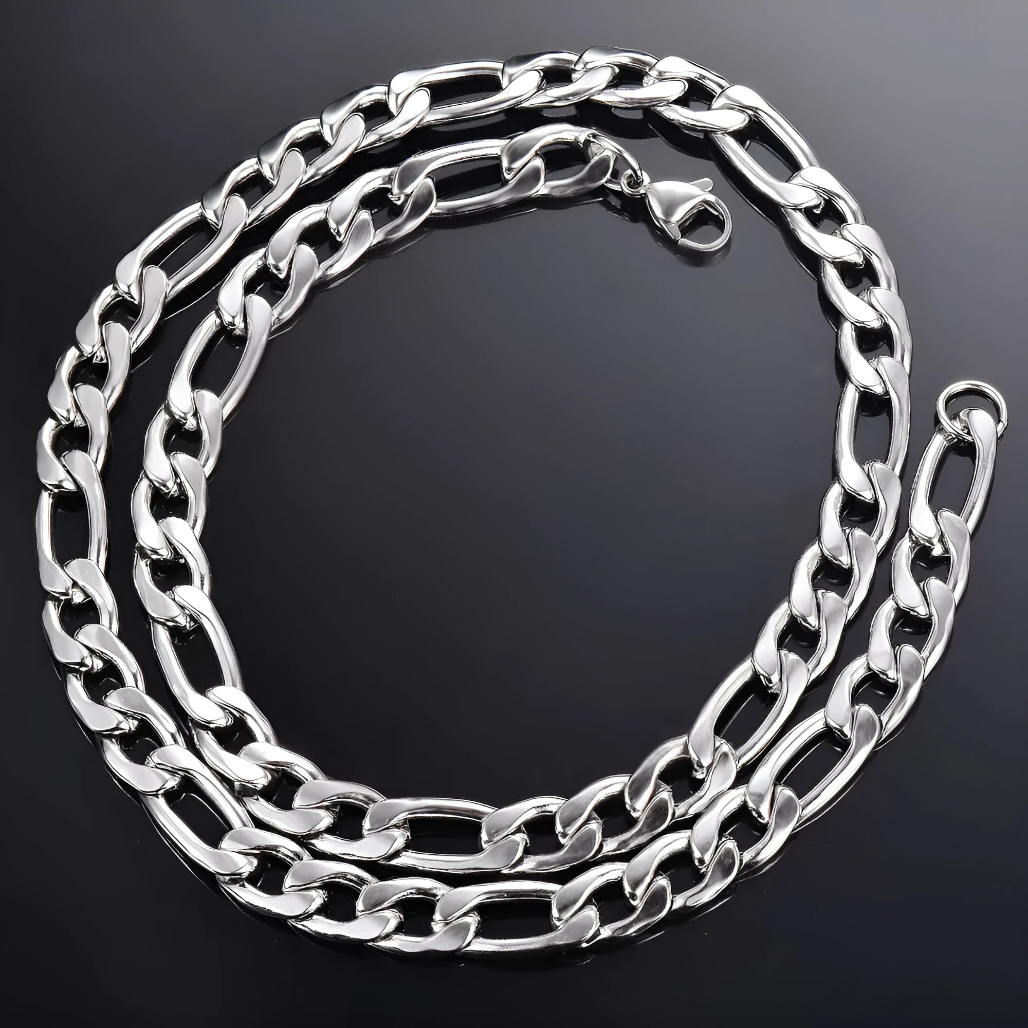 Silver stainless steel Figaro Cuba chain necklace on white background