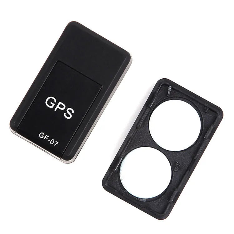 Black plastic magnetic GPS car tracker device measuring 35x20x14mm with USB charging cable