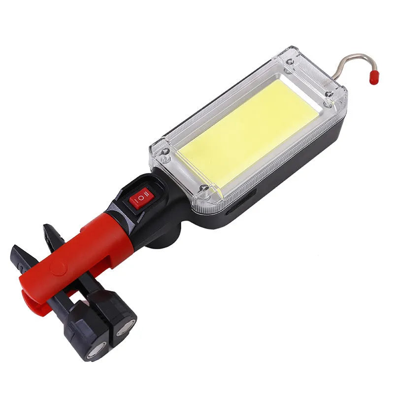 Red COB LED rechargeable flashlight with magnetic base, showing scale and USB cable.