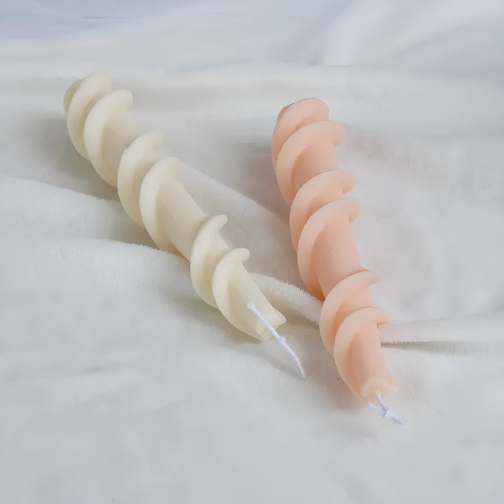 Silicone spiral lace rod candle mould for making decorative pillar candles.