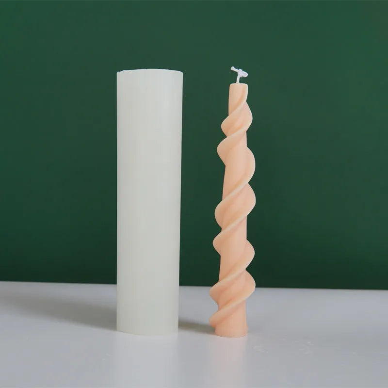 Silicone spiral lace rod candle mould for making decorative pillar candles.