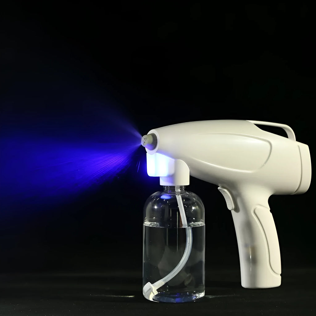 White handheld cordless electric spray gun with USB charging cable on a white background.