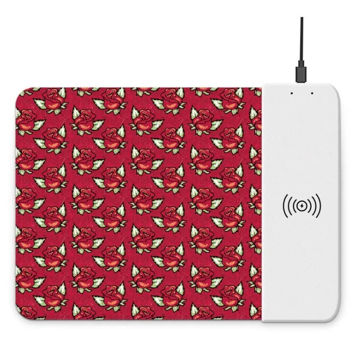 Cartoon pattern wireless charging mouse pad with RGB lighting showing smartphone charging on surface
