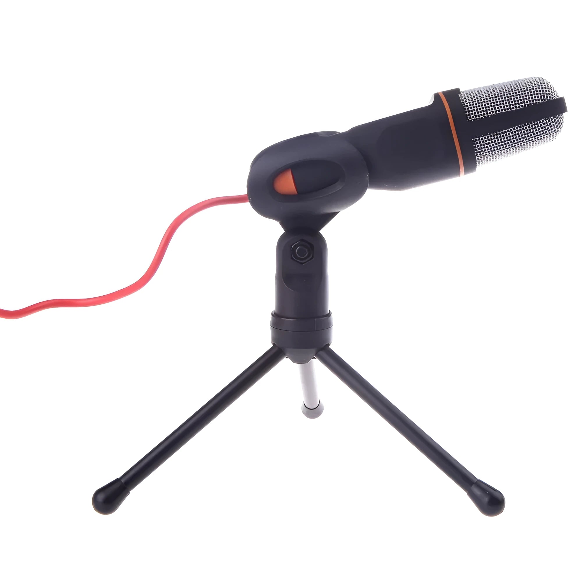 Black wired PC microphone with a metal clip holder on a desk next to a computer.