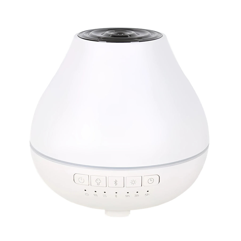 Round white Bluetooth humidifier and essential oil diffuser with night light on wooden surface