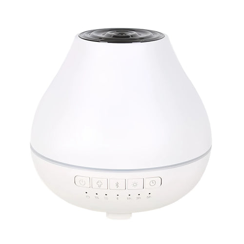 Round white Bluetooth humidifier and essential oil diffuser with night light on wooden surface