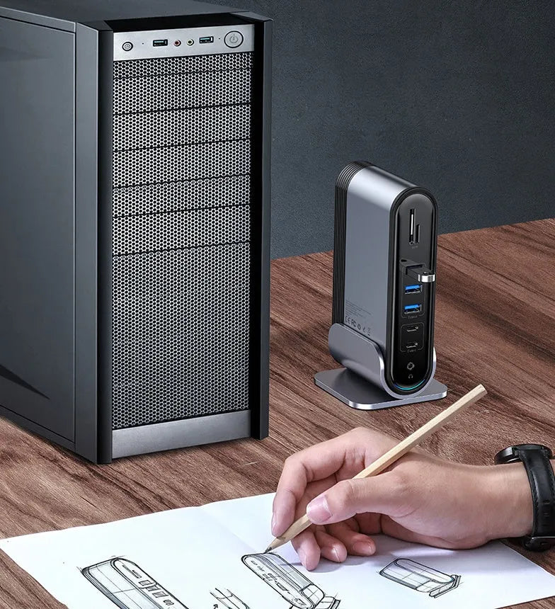 Deep space grey 16-in-1 Type-C docking station with external power supply on a desk.