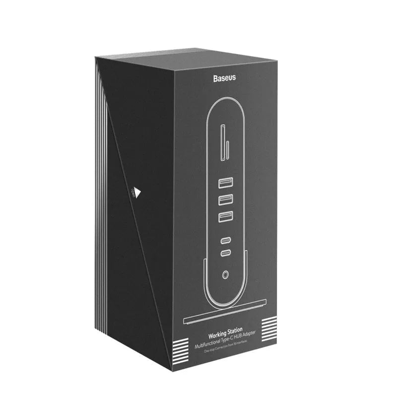 Deep space grey 16-in-1 Type-C docking station with external power supply on a desk.