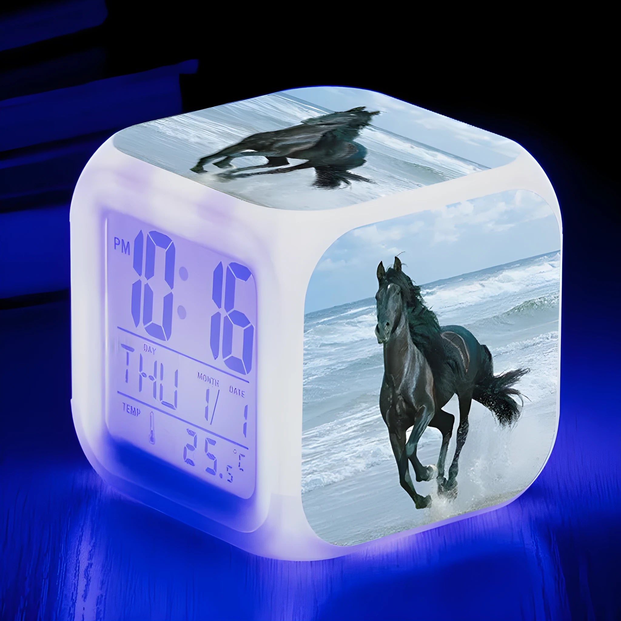 Small square plastic LED alarm clock showing time and temperature on its display.