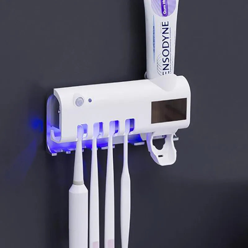 Smart UV toothbrush steriliser with automatic toothpaste dispenser wall mounted in bathroom