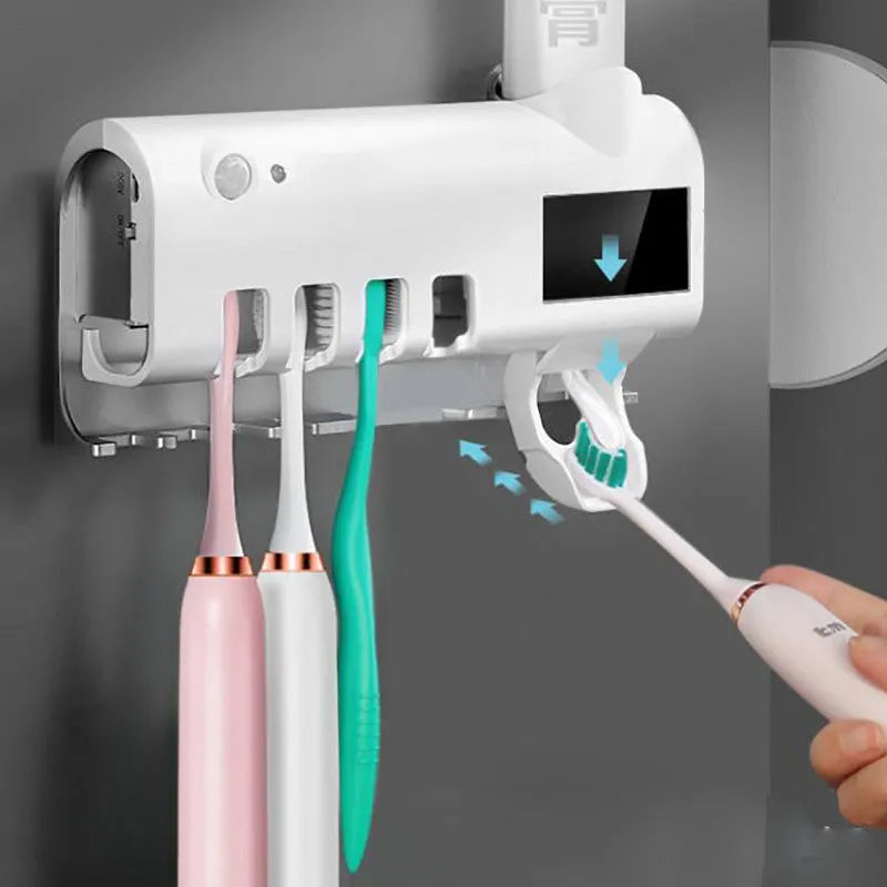 Smart UV toothbrush steriliser with automatic toothpaste dispenser wall mounted in bathroom
