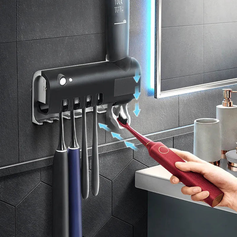 Smart UV toothbrush steriliser with automatic toothpaste dispenser wall mounted in bathroom