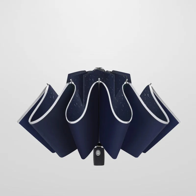 Black automatic reverse folding umbrella shown open, demonstrating its 10-rib canopy structure and plastic non-slip handle.