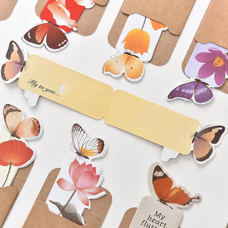 A single butterfly design paper bookmark with dimensions 13.5 cm by 5.5 cm.