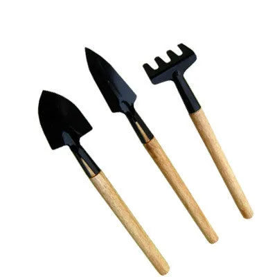 Succulent gardening tools set with tweezers, mini rake, spray bottle and blue orange seedling cloth on white background