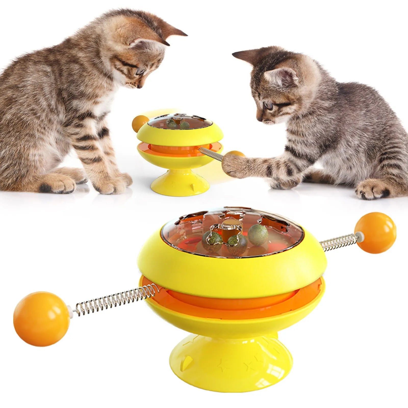 Rotatable cat toy with colourful turntable, stick elements, and transparent top holding catnip balls on a suction cup base.