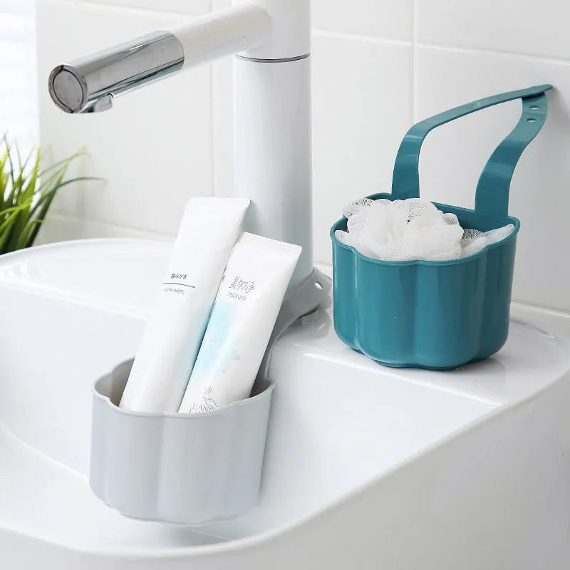 Plastic sink drain basket in Nordic style, shown in dark blue, measuring 20 cm long by 10 cm wide.