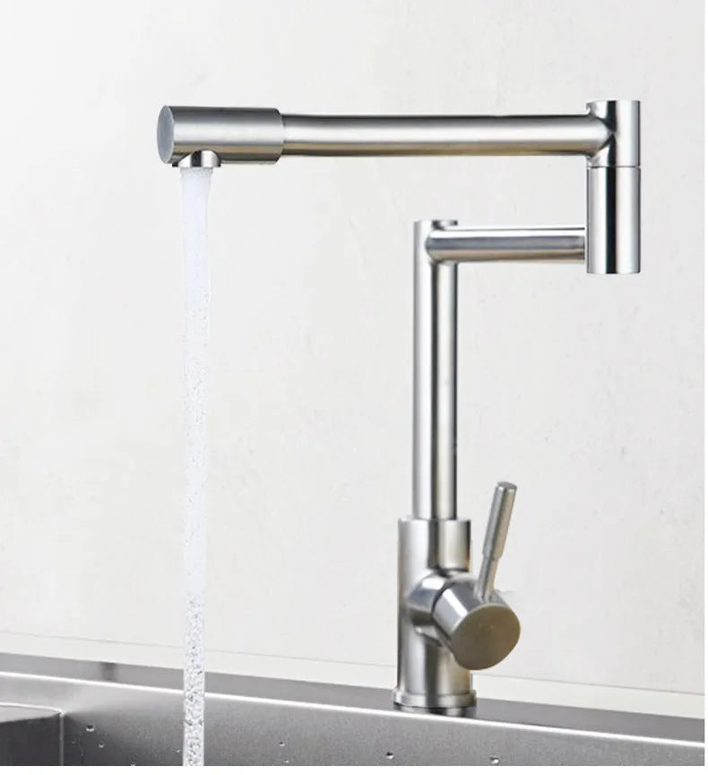 Silver stainless steel kitchen sink mixer tap with dual handles and 360-degree rotating spout