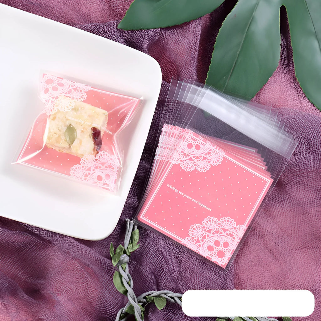 Pink self-adhesive plastic packaging bags for handmade soap, showing size and gusset