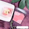 Pink self-adhesive plastic packaging bags for handmade soap, showing size and gusset