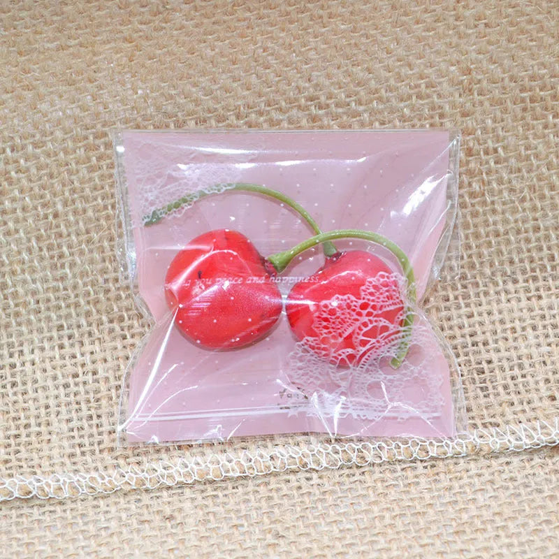 Pink self-adhesive plastic packaging bags for handmade soap, showing size and gusset