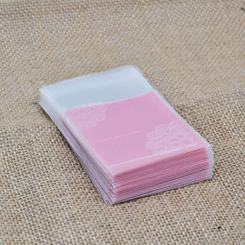 Pink self-adhesive plastic packaging bags for handmade soap, showing size and gusset