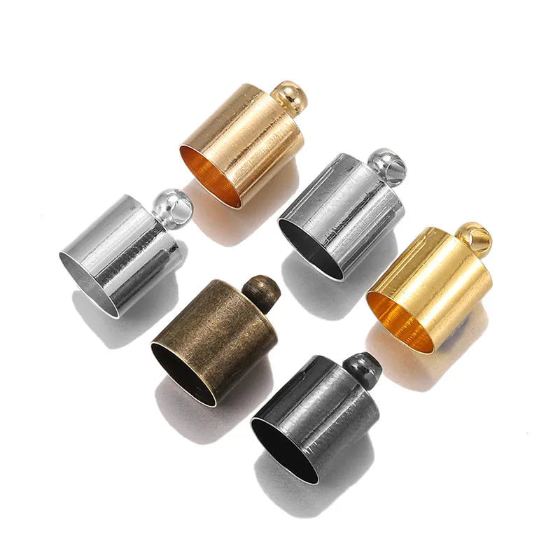 Assortment of small, shiny copper weight caps in various sizes and metallic colours for jewellery making.