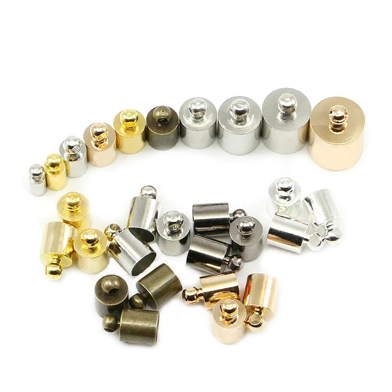 Assortment of small, shiny copper weight caps in various sizes and metallic colours for jewellery making.
