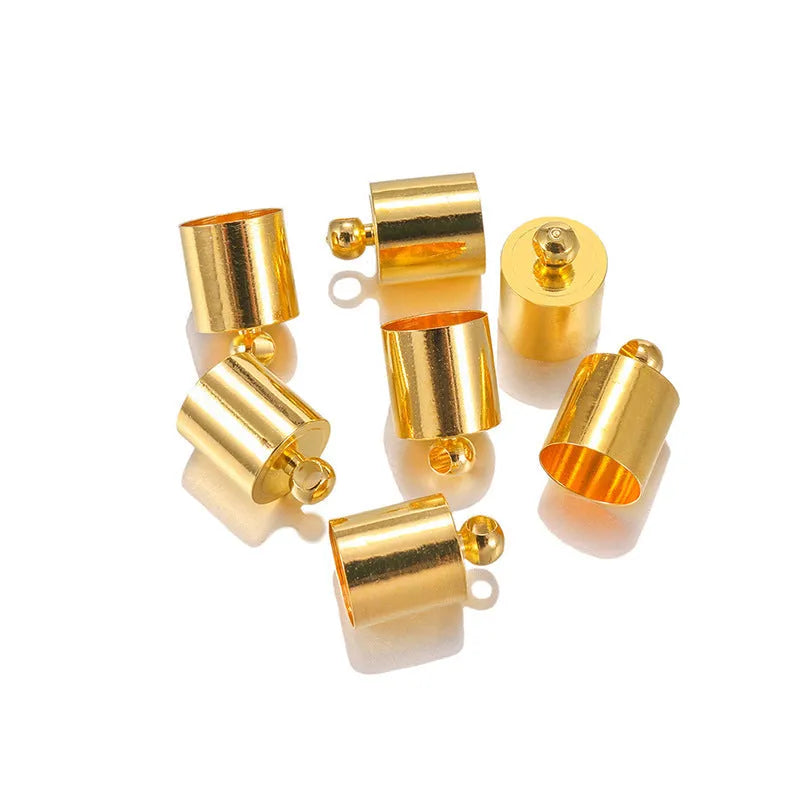 Assortment of small, shiny copper weight caps in various sizes and metallic colours for jewellery making.