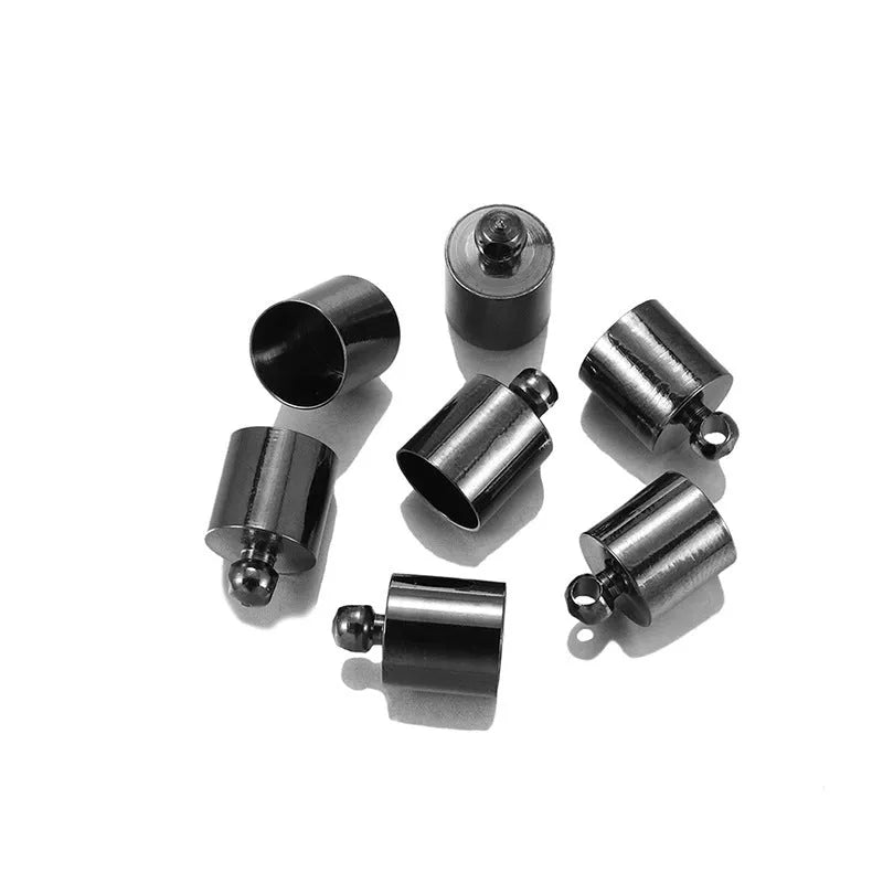 Assortment of small, shiny copper weight caps in various sizes and metallic colours for jewellery making.