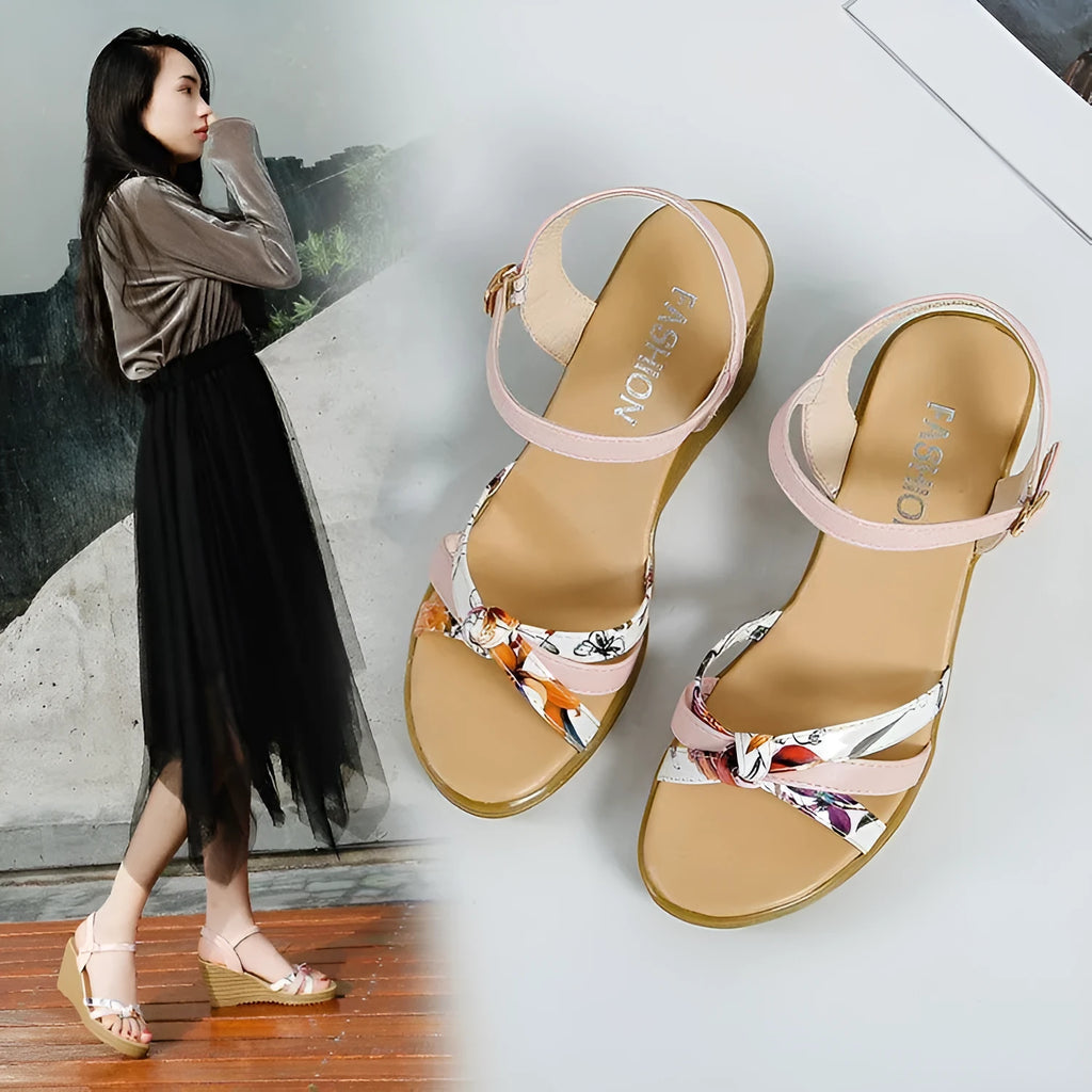 Women's pink wedge sandals with thick heel and fish mouth opening showing adjustable buckle closure