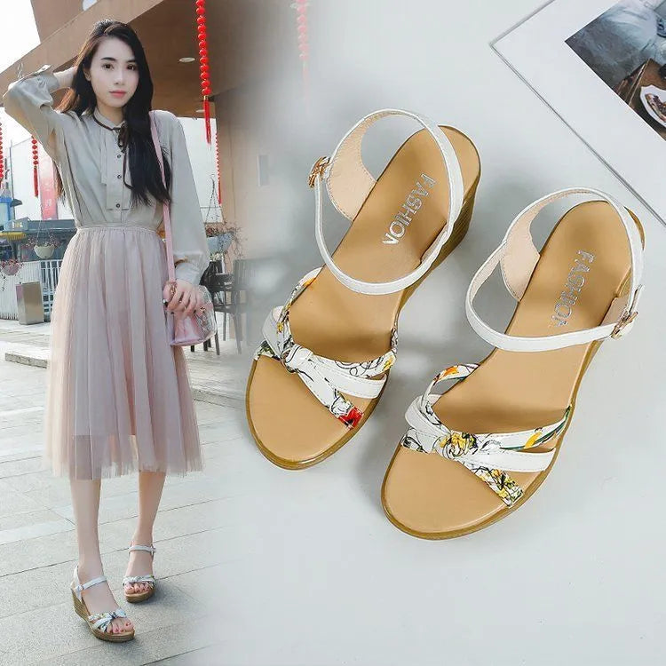 Women's pink wedge sandals with thick heel and fish mouth opening showing adjustable buckle closure