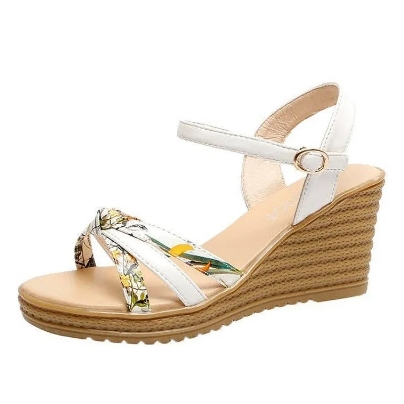 Women's pink wedge sandals with thick heel and fish mouth opening showing adjustable buckle closure