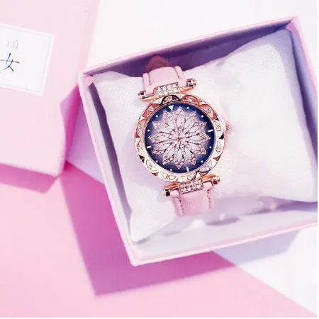 Women's fashion watch with diamond bezel, round 32mm dial, available in multiple colours on a pin buckle strap.