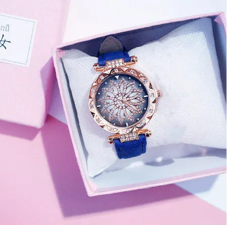 Women's fashion watch with diamond bezel, round 32mm dial, available in multiple colours on a pin buckle strap.