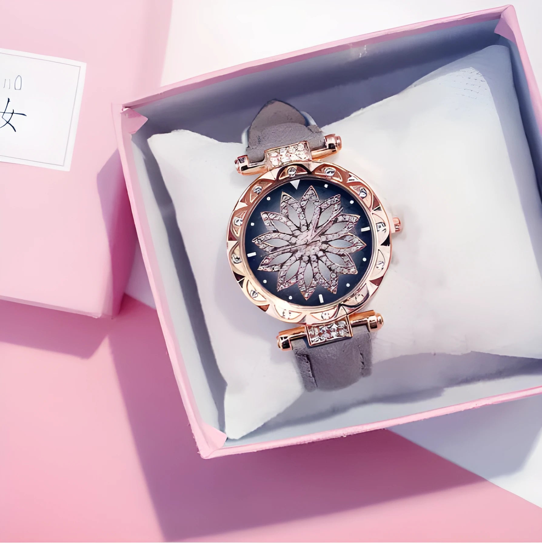 Women's fashion watch with diamond bezel, round 32mm dial, available in multiple colours on a pin buckle strap.