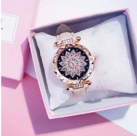 Women's fashion watch with diamond bezel, round 32mm dial, available in multiple colours on a pin buckle strap.