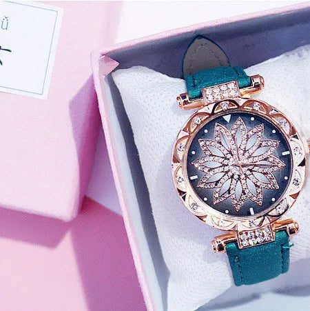 Women's fashion watch with diamond bezel, round 32mm dial, available in multiple colours on a pin buckle strap.