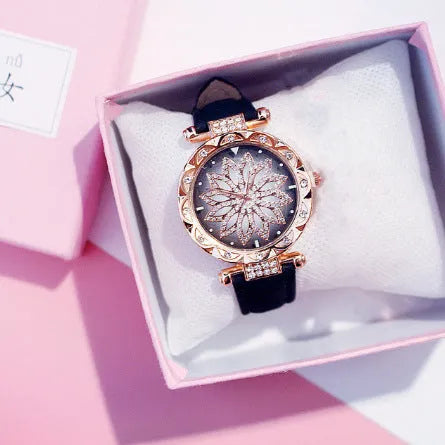 Women's fashion watch with diamond bezel, round 32mm dial, available in multiple colours on a pin buckle strap.
