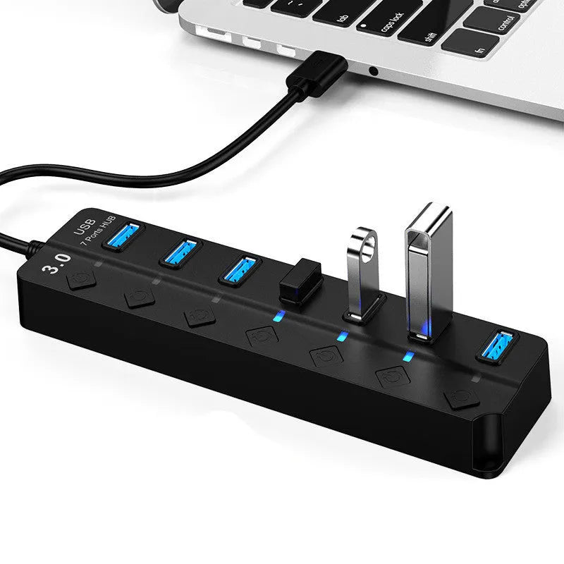 Black USB 3.0 hub with seven ports and external power adapter