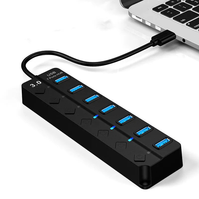 Black USB 3.0 hub with seven ports and external power adapter
