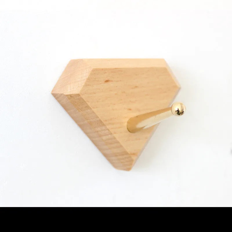 Beech wood adhesive wall hook with brass hook in five shape options including round, capsule, oval, diamond and square